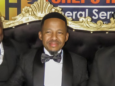 Mr Tshepo Hope Thubela, founder of Tshepo Hope Funerals, seated in the centre